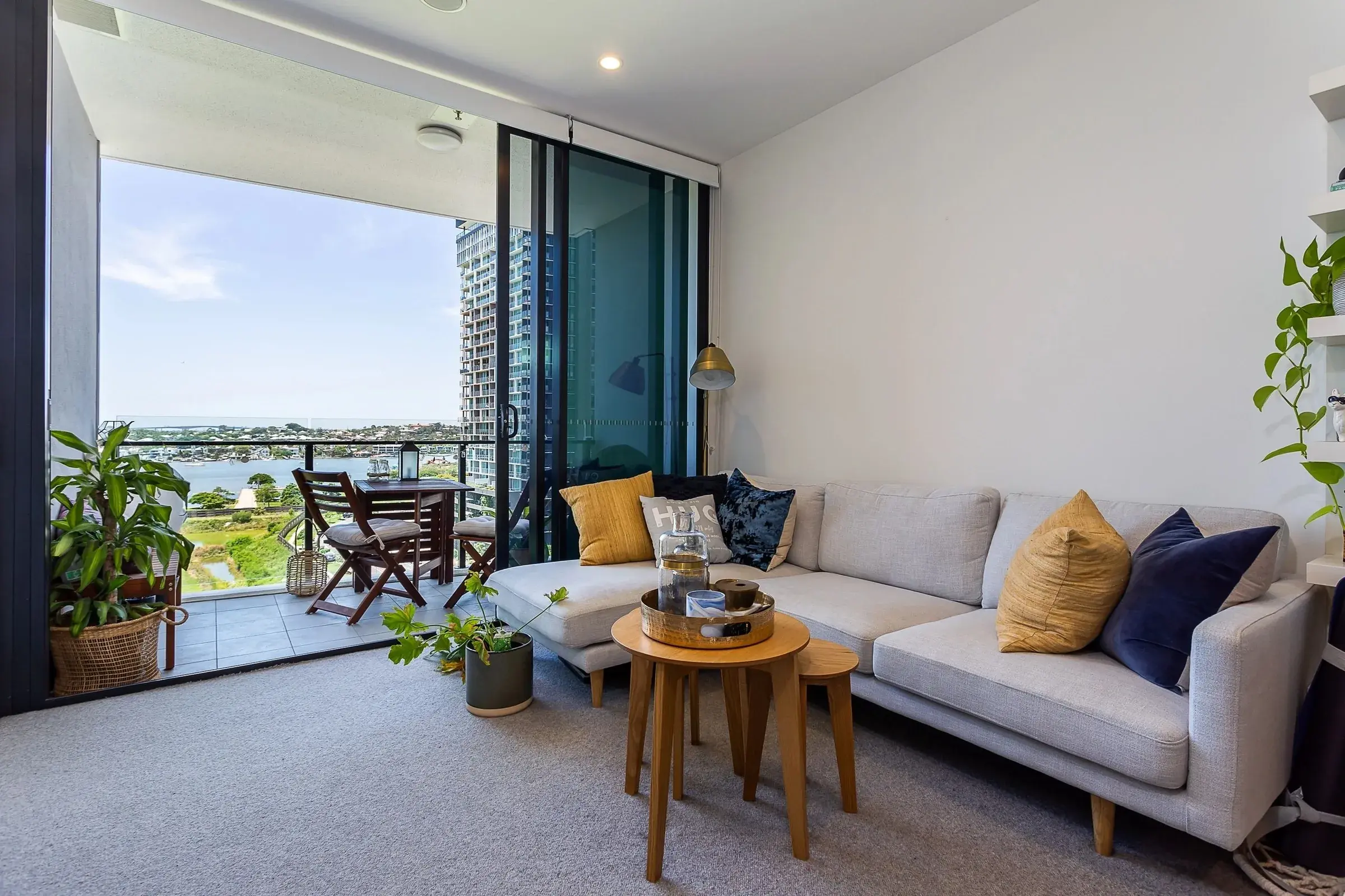 Living room opening onto a balcony over the water